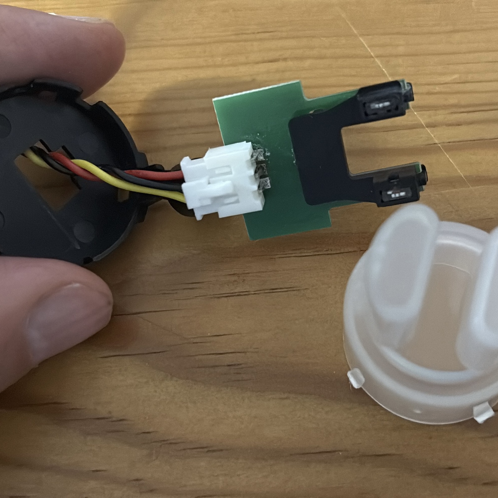 Seeed Grove turbidity sensor opened up, showing the optical transmittance head, 3-wire cable and diffuser cap